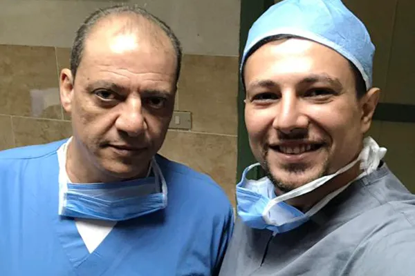 With a colleague in scrubs